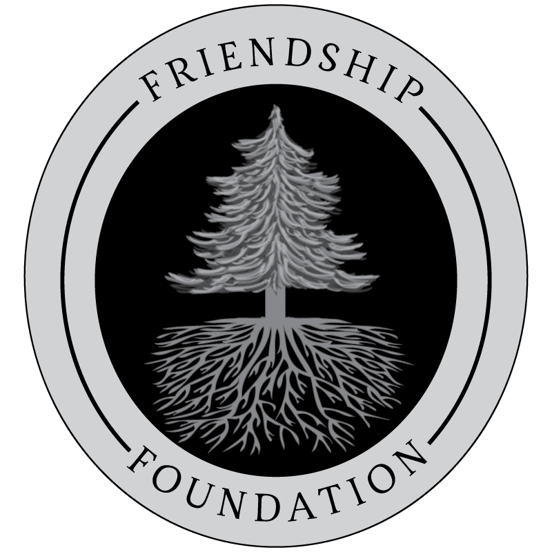 Friendship Foundation logo with a tree and roots design in a circular emblem.