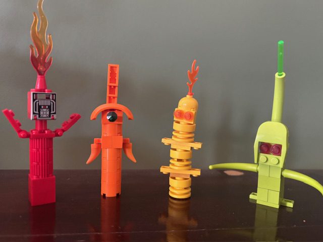 Colorful LEGO models by Andy Grover representing the POP! puppets—POPO, POPUP, POPLI, POPETTE, and POPOTIN